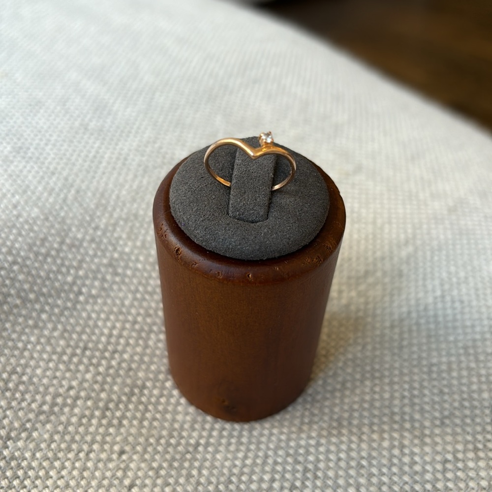 Gold ring with a small stone, made in Ukraine